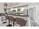 Modern kitchen with stainless steel appliances and convenient breakfast bar seating at 1515 Forrest Nelson Blvd # Q205, Port Charlotte, FL 33952