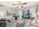 Inviting living room with neutral colors and a sliding door to the screened in lanai at 1515 Forrest Nelson Blvd # Q205, Port Charlotte, FL 33952