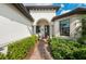 Inviting front entrance with brick walkway and lush landscaping at 16741 Ellsworth Ave, Bradenton, FL 34202