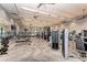 Community gym providing modern exercise equipment and a mirrored wall at 16741 Ellsworth Ave, Bradenton, FL 34202