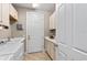Functional laundry area with storage and countertop space for folding at 16741 Ellsworth Ave, Bradenton, FL 34202