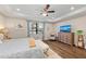 Main bedroom featuring a bed with luxury linens, tray ceiling, and hardwood floors at 16741 Ellsworth Ave, Bradenton, FL 34202