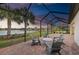 Idyllic outdoor view from the screened patio at dusk showcasing the lake at 16741 Ellsworth Ave, Bradenton, FL 34202
