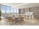 Contemporary kitchen with sleek cabinetry, island seating, and stunning city view at 1703 Main St # Ph 3, Sarasota, FL 34236