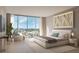 Serene bedroom featuring a large window showcasing city views, creating a tranquil retreat at 1703 Main St # Ph 3, Sarasota, FL 34236