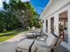 Seating area on the deck with plush chairs and a manicured lawn at 1950 Alta Vista St, Sarasota, FL 34236