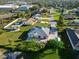 Aerial view of a home showcasing its spacious lot, private pool, and landscaped yard at 222 Pine Glen Ct, Englewood, FL 34223