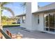 Rear of home featuring a patio and sliding glass doors at 222 Pine Glen Ct, Englewood, FL 34223
