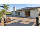 Relaxing backyard patio offers outdoor seating and beautiful views of the lush surroundings at 222 Pine Glen Ct, Englewood, FL 34223