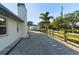 Spacious backyard with new landscaping, a patio, and a view of mature trees at 222 Pine Glen Ct, Englewood, FL 34223