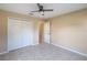 Bedroom with ceiling fan and closet at 222 Pine Glen Ct, Englewood, FL 34223