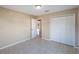 Bedroom with tile floors, closet, and neutral paint, creating a serene atmosphere at 222 Pine Glen Ct, Englewood, FL 34223