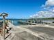 Boat ramp area with docks and blue skies leading to the water for easy boat launching at 222 Pine Glen Ct, Englewood, FL 34223