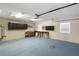 Spacious garage with a well-lit workspace and ample room for storage at 222 Pine Glen Ct, Englewood, FL 34223
