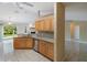 Large kitchen with stainless steel appliances, granite countertops, and backyard view at 222 Pine Glen Ct, Englewood, FL 34223