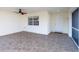 Screened lanai featuring neutral tile flooring and access to the backyard at 222 Pine Glen Ct, Englewood, FL 34223