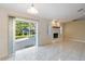 Bright living room with access to an outdoor patio through sliding doors at 222 Pine Glen Ct, Englewood, FL 34223