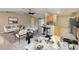 Staged living room with open floor plan to kitchen and dining at 222 Pine Glen Ct, Englewood, FL 34223
