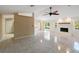 Empty living room with a fireplace, sliding glass doors, and tile flooring at 222 Pine Glen Ct, Englewood, FL 34223