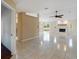 Spacious living room boasts a fireplace, neutral paint, tile floors, and natural light at 222 Pine Glen Ct, Englewood, FL 34223