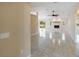 Inviting living room showcasing tile floors, a cozy fireplace, and a bright, open layout at 222 Pine Glen Ct, Englewood, FL 34223