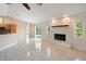 The living room features a decorative fireplace, tile floors, and ample light at 222 Pine Glen Ct, Englewood, FL 34223