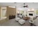 Staged living room with fireplace, furniture, and decor for an inviting space at 222 Pine Glen Ct, Englewood, FL 34223