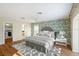 Inviting main bedroom boasts stylish decor, ample natural light, and a spacious closet at 222 Pine Glen Ct, Englewood, FL 34223