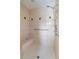 Walk-in shower with bench, shower head and grab bar at 222 Pine Glen Ct, Englewood, FL 34223