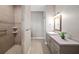 Bathroom showcasing stylish vanity, modern fixtures, and tiled shower at 25605 69Th E Ave, Myakka City, FL 34251