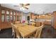 Dining room and kitchen featuring hardwood floors, built in cabinets, and kitchen island at 25605 69Th E Ave, Myakka City, FL 34251