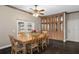 Dining room featuring hardwood floors, built in cabinets, a ceiling fan, and a dining table at 25605 69Th E Ave, Myakka City, FL 34251