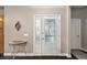 Inviting foyer features decorative glass front door and tiled floor at 25605 69Th E Ave, Myakka City, FL 34251