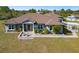 Lovely home with a covered porch, manicured garden, well-kept lawn and pavers at 25605 69Th E Ave, Myakka City, FL 34251