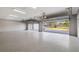 Spacious garage with epoxy flooring and multiple garage door openers installed at 25605 69Th E Ave, Myakka City, FL 34251