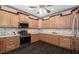 Open kitchen with stainless steel appliances, granite countertops and wood cabinets at 25605 69Th E Ave, Myakka City, FL 34251