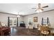 Bright living room features French doors, ceiling fans, and views of the property at 25605 69Th E Ave, Myakka City, FL 34251