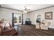 Comfortable living room boasts natural light from French doors leading to the outdoors at 25605 69Th E Ave, Myakka City, FL 34251