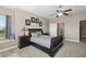 Main bedroom featuring neutral paint, large window, and ceiling fan at 25605 69Th E Ave, Myakka City, FL 34251