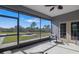 Screened patio featuring peaceful outdoor views and neutral decor at 25605 69Th E Ave, Myakka City, FL 34251