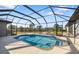 Screened-in pool overlooking a backyard, with room for entertaining at 25605 69Th E Ave, Myakka City, FL 34251