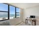 Bright bedroom with a large window showcasing a stunning beach view at 2675 Gulf Of Mexico Dr # 301, Longboat Key, FL 34228