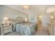 Comfortable bedroom with serene décor, access to an en-suite bathroom, and ample natural light at 2675 Gulf Of Mexico Dr # 301, Longboat Key, FL 34228