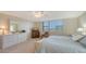 Relaxing bedroom with dresser, neutral tones, comfortable seating, and great natural light at 2675 Gulf Of Mexico Dr # 301, Longboat Key, FL 34228