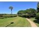 Well maintained green space with beautiful trees and a walkway to the beach at 2675 Gulf Of Mexico Dr # 301, Longboat Key, FL 34228