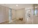 Spacious entry hallway with decorative door, tile floors, and convenient coat closet at 2675 Gulf Of Mexico Dr # 301, Longboat Key, FL 34228