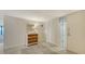 Entry hallway featuring tile flooring, decorative mirror, and closet space at 2675 Gulf Of Mexico Dr # 301, Longboat Key, FL 34228