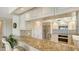 Kitchen with stainless steel appliances, granite countertops, and a breakfast bar at 2675 Gulf Of Mexico Dr # 301, Longboat Key, FL 34228