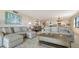 Bright living room with comfortable seating and an open layout that flows seamlessly with the rest of the home at 2675 Gulf Of Mexico Dr # 301, Longboat Key, FL 34228