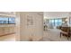 Open-concept living area leading to kitchen, showcasing seamless flow and serene ambiance at 2675 Gulf Of Mexico Dr # 301, Longboat Key, FL 34228